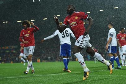 Manchester Uniteds Belgian striker Romelu Lukaku celebrates scoring his teams second goal during the UEFA Champions League Group A football match between Manchester United and Basel at Old Trafford in Manchester, north west England on September 12, 2017. / AFP PHOTO / Oli SCARFF