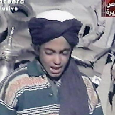 (FILES) This file photo taken on November 7, 2001 shows Hamza, who appears to be the youngest son of prime terror suspect Saudi born Osama bin Laden, reciting a poem extolling Kabul and Mullah Mohammad Omar, supreme leader of Afghanistans Taliban rulers, in this frame grab taken from the Qatar based al-Jazeera satellite news channel.  
The photomontage, which was published on September 11, 2017 by Al-Qaeda for the 16th anniversary of the September 11, 2001 attacks shows the face of Osama bin Laden in the twin towers next to his son Hamza. 

 / AFP PHOTO / AL-JAZEERA / STRINGER