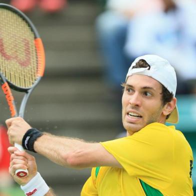 Guilherme Clezar of Brazil hits a return to Yuichi Sugita of Japan during the first tennis match of the Davis Cup World Group playoff between Japan and Brazil in Osaka on September 15, 2017.  / AFP PHOTO / JIJI PRESS / STR / Japan OUT