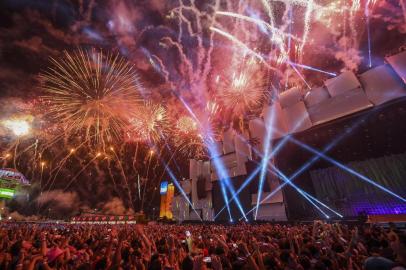 Spectators at the World Stage watch fireworks go off on the first day of Rock in Rio, in Rio de Janeiro, Brazil, on September 15, 2017. 
Running for seven days in all -- Friday through Sunday and then September 21 to 24 -- Rock in Rio is being welcomed by the city as a chance to put the huge facilities built for the 2016 Olympic Games back in use. They have hosted only sporadic events since the Olympics ended in August of that year. While Brazil is only starting to emerge from a painful recession, the 700,000 tickets to the event sold out months ago and city hotels are hoping to be nearly full, reversing a prolonged post-Olympic slump. / AFP PHOTO / Apu Gomes