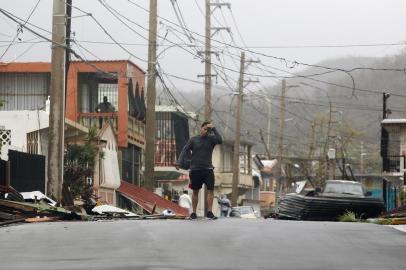 Aftermaths after hurricane Maria hit the Caribbean islands

A man gestures as he walks through a debris covered road as Hurricane Maria hits Puerto Rico in Fajardo, on September 20, 2017.
Maria made landfall on Puerto Rico, pummeling the US territory after already killing at least two people on its passage through the Caribbean. The US National Hurricane Center warned of large and destructive waves as Maria came ashore near Yabucoa on the southeast coast. / AFP PHOTO / Ricardo ARDUENGO

Editoria: DIS
Local: Fajardo
Indexador: RICARDO ARDUENGO
Secao: disaster (general)
Fonte: AFP
Fotógrafo: STR