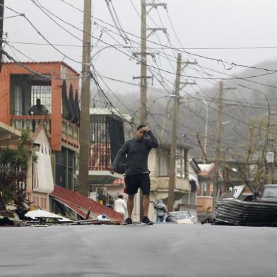 Aftermaths after hurricane Maria hit the Caribbean islands

A man gestures as he walks through a debris covered road as Hurricane Maria hits Puerto Rico in Fajardo, on September 20, 2017.
Maria made landfall on Puerto Rico, pummeling the US territory after already killing at least two people on its passage through the Caribbean. The US National Hurricane Center warned of large and destructive waves as Maria came ashore near Yabucoa on the southeast coast. / AFP PHOTO / Ricardo ARDUENGO

Editoria: DIS
Local: Fajardo
Indexador: RICARDO ARDUENGO
Secao: disaster (general)
Fonte: AFP
Fotógrafo: STR