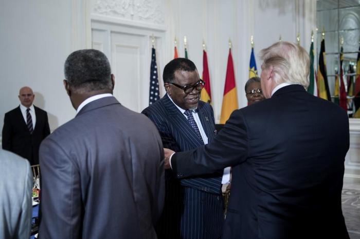 US President Donald Trump lunch with US and African leaders

US President Donald Trump (R) greets Namibias President Dr. Hage G. Geingob  before a luncheon with US and African leaders at the Palace Hotel during the 72nd United Nations General Assembly on September 20, 2017 in New York. / AFP PHOTO / Brendan Smialowski

Editoria: POL
Local: New York
Indexador: BRENDAN SMIALOWSKI
Secao: diplomacy
Fonte: AFP
Fotógrafo: STF