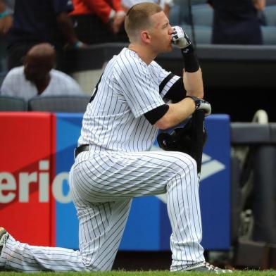 NEW YORK, NY - SEPTEMBER 20: Todd Frazier #29 of the New York Yankees reacts after a child was hit by a foul ball off his bat in the fifth inning against the Minnesota Twins on September 20, 2017 at Yankee Stadium in the Bronx borough of New York City.   Abbie Parr/Getty Images/AFP