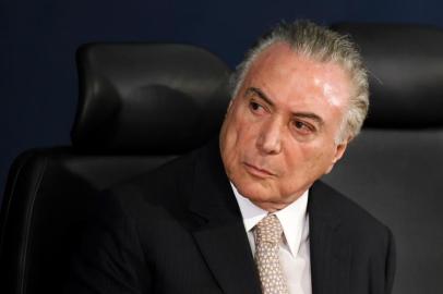 Brazilian President Michel Temer attends the inauguration of the countrys new Attorney General, Raquel Dodge, in Brasilia on September 18, 2017.
Dodge took over to oversee an avalanche of corruption investigations, including against President Michel Temer, and promised that no one would be above the law. Dodge replaced the hard hitting Rodrigo Janot who last week rounded off his dramatic term in office by charging Temer with racketeering and obstruction of justice. / AFP PHOTO / EVARISTO SA