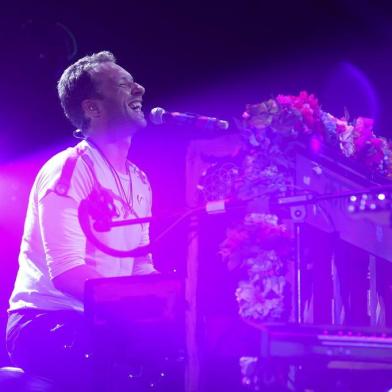 Chris Martin from Coldplay performs on stage during the Global Citizen Festival G20 benefit concert at the Barclaycard Arena in Hamburg, northern Germany on July 6, 2017 on the eve of the G20 summit. Leaders of the worlds top economies will gather from July 7 to 8, 2017 in Germany for likely the stormiest G20 summit in years, with disagreements ranging from wars to climate change and global trade. / AFP PHOTO / Ronny HARTMANN