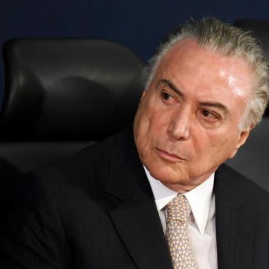 Brazilian President Michel Temer attends the inauguration of the countrys new Attorney General, Raquel Dodge, in Brasilia on September 18, 2017.
Dodge took over to oversee an avalanche of corruption investigations, including against President Michel Temer, and promised that no one would be above the law. Dodge replaced the hard hitting Rodrigo Janot who last week rounded off his dramatic term in office by charging Temer with racketeering and obstruction of justice. / AFP PHOTO / EVARISTO SA