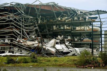  

(FILES) This file photo taken on August 26, 2017 shows damaged boats in a multi-level storage facility seen following passage of Hurricane Harvey at Rockport, Texas.
US payrolls contracted in September for the first time in seven years as major hurricanes left workers idled in southern states but unemployment continued to fall, official data showed on October 6, 2017. Total non-farm employment fell by 33,000 net positions for the month, with a steep drop-off in hiring at restaurants and bars, according to the Labor Department. But the unemployment rate fell another two tenths to 4.2 percent, its lowest level since February of 2001. / AFP PHOTO / MARK RALSTON

Editoria: WEA
Local: Rockport
Indexador: MARK RALSTON
Secao: forecast
Fonte: AFP
Fotógrafo: STF