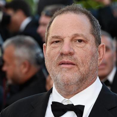 (FILES) This file photo taken on May 22, 2015 shows 
US producer Harvey Weinstein arriving for the screening of the film The Little Prince at the 68th Cannes Film Festival in Cannes.    
Weinstein was fired from his film studio the Weinstein Company on October 8, 2017, following reports that he sexually harassed women over several decades, according to US media. / AFP PHOTO / LOIC VENANCE