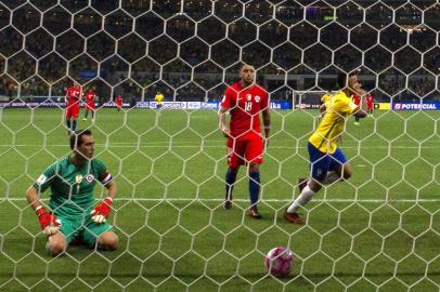 Brazils Gabriel Jesus (R) celebrates after scoring against Chile during their 2018 World Cup football qualifier match in Sao Paulo, Brazil, on October 10, 2017. / AFP PHOTO / Miguel SCHINCARIOL