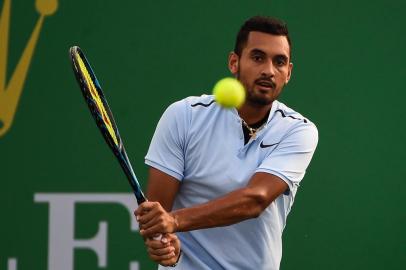 Nick Kyrgios of Australia hits a return during the mens singles against Steve Johnson of America at the Shanghai Masters tennis tournament in Shanghai on October 10, 2017. / AFP PHOTO / CHANDAN KHANNA