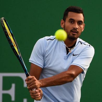 Nick Kyrgios of Australia hits a return during the mens singles against Steve Johnson of America at the Shanghai Masters tennis tournament in Shanghai on October 10, 2017. / AFP PHOTO / CHANDAN KHANNA