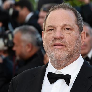 (FILES) This file photo taken on May 22, 2015 shows US producer Harvey Weinstein arriving for the screening of the film The Little Prince at the 68th Cannes Film Festival in Cannes.    Weinstein was fired from his film studio the Weinstein Company on October 8, 2017, following reports that he sexually harassed women over several decades, according to US media. / AFP PHOTO / LOIC VENANCE