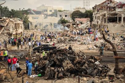 A picture taken on October 15, 2017 shows a general view of the scene of the explosion of a truck bomb in the centre of Mogadishu. A truck bomb exploded outside a hotel at a busy junction in Somalia's capital Mogadishu on October 14, 2017 causing widespread devastation that left at least 20 dead, with the toll likely to rise.