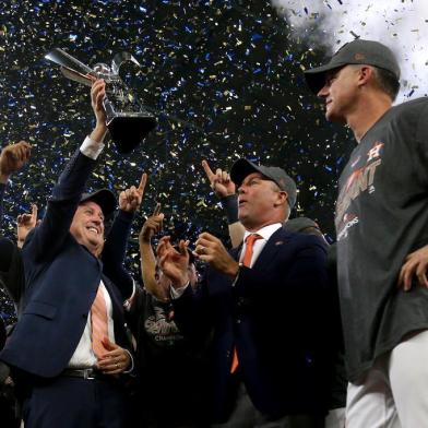 HOUSTON, TX - OCTOBER 21: The Houston Astros celebrate with the The William Harridge Trophy after defeating the New York Yankees by a score of 4-0 to win Game Seven of the American League Championship Series at Minute Maid Park on October 21, 2017 in Houston, Texas. The Houston Astros advance to face the Los Angeles Dodgers in the World Series.   Elsa/Getty Images/AFP