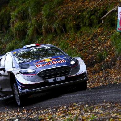 French driver Sebastien Ogier and co pilot Julien Ingrassia compete in their Ford Fiesta WRC during the special stage 19 of the Wales Rally GB, the penultimate stage of the FIA World Rally Championship, in Gwydir, Mid Wales on October 29, 2017. / AFP PHOTO / Geoff CADDICK