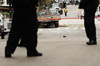 New York City Deals With Aftermath Of Terror Attack In Manhattan

NEW YORK, NY - NOVEMBER 01: Police stand near the crashed vehicle used in what is being described as a terrorist attack sits in lower Manhattan the morning after the event on November 1, 2017 in New York City. Eight people were killed and 12 were injured on Tuesday afternoon when suspect 29-year-old Sayfullo Saipov, a legal resident from Uzbekistan, intentionally drove a truck onto a bike path in lower Manhattan.   Spencer Platt/Getty Images/AFP

Editoria: WAR
Local: New York
Indexador: SPENCER PLATT
Secao: Act of terror
Fonte: GETTY IMAGES NORTH AMERICA
Fotógrafo: STF