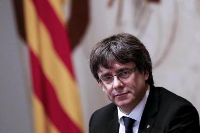 Catalan regional government president Carles Puigdemont attends a regional government meeting at the Generalitat Palace in Barcelona on October 10, 2017. Spain's worst political crisis in a generation will come to a head as Catalonia's leader could declare independence from Madrid in a move likely to send shockwaves through Europe.  / AFP PHOTO / PAU BARRENA