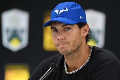 Spains Rafael Nadal addresses a press conference ahead of the quarter-final round at the ATP World Tour Masters 1000 indoor tennis tournament on November 3, 2017 in Paris.World number one Rafael Nadal pulled out of the Paris Masters on November 3 before his quarter-final with a knee injury. / AFP PHOTO / CHRISTOPHE ARCHAMBAULT