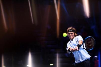 Russias Andrey Rublev returns a shot to South Koreas Hyeon Chung during their mens singles tennis match of the first edition of the Next Generation ATP Finals in Milan on November 8, 2017, an annual mens youth tennis tournament organized by the Italian Tennis Federation and the Italian Olympic Committee. / AFP PHOTO / MARCO BERTORELLO