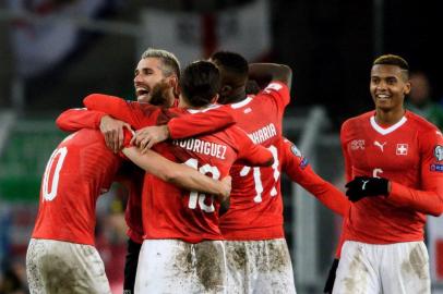  Swiss players celebrates their qualification at the end of the FIFA 2018 World Cup play-off second leg football match between Switzerland and Northern Ireland at St. at St. Jakob-Park Stadium on November 12, 2017. / AFP PHOTO / Editoria: SPOLocal: BaselIndexador: FABRICE COFFRINISecao: soccerFonte: AFPFotógrafo: STF