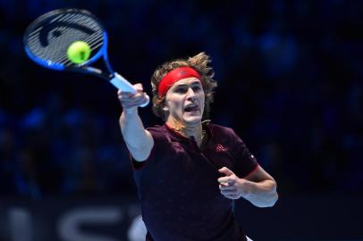 Germanys Alexander Zverev returns to US player Jack Sock during their mens singles round-robin match on day five of the ATP World Tour Finals tennis tournament at the O2 Arena in London on November 16 2017. / AFP PHOTO / Glyn KIRK