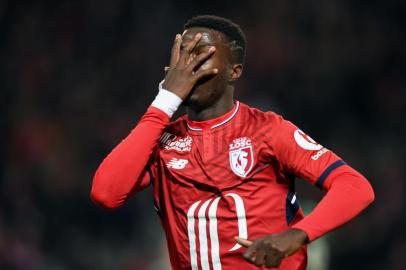 Lilles French-Ivorian forward Nicolas Pepe celebrates after scoring a goal during the French L1 football match between Lille (LOSC) and Saint Etienne (ASSE) at the Pierre-Mauroy stadium in Villeneuve dAscq, northern France, on November 17, 2017.   / AFP PHOTO / DENIS CHARLET