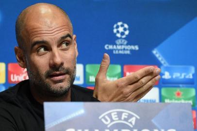 Manchester Citys Spanish manager Pep Guardiola attends a press conference at the City Football Academy in Manchester, north west England on November 20, 2017, on the eve of their UEFA Champions League Group F match against Feyenoord. / AFP PHOTO / Oli SCARFF