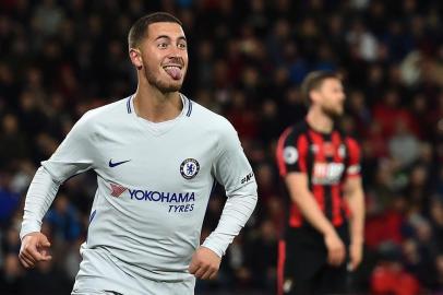 Chelsea's Belgian midfielder Eden Hazard celebrates after scoring the opening goal of the English Premier League football match between Bournemouth and Chelsea at the Vitality Stadium in Bournemouth, southern England on October 28, 2017. / AFP PHOTO / Glyn KIRK / RESTRICTED TO EDITORIAL USE. No use with unauthorized audio, video, data, fixture lists, club/league logos or 'live' services. Online in-match use limited to 75 images, no video emulation. No use in betting, games or single club/league/player publications.  / 