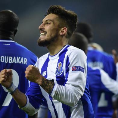 Porto's Brazilian defender Alex Telles celebrates after scoring a goal during their UEFA Champions League group G football match FC Porto vs Monaco at the Dragao stadium in Porto, on December 6, 2017. / AFP PHOTO / MIGUEL RIOPA