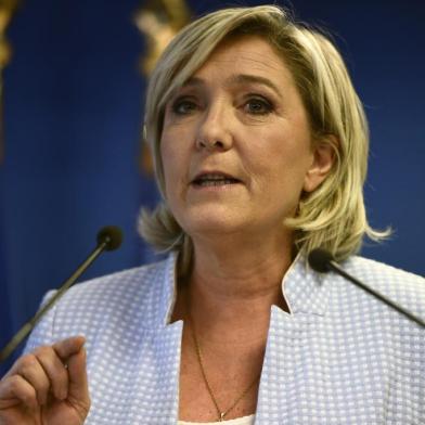 President of the French far-right party and presidential candidate for the 2017 French Presidential elections Marine Le Pen delivers a speech during a press conference on november 9, 2016 in the party headquarters inNanterre, near Paris, following the victory by US Republican candidate Donald Trump in US presidential elections. Marine Le Pen said on November 9, 2016 that Donald Trumps election to the US presidency was good news for France in a speech. Donald Trump has stunned America and the world,  riding a wave of populist resentment to defeat Hillary Clinton in the race to become the 45th president of the United States. The Republican mogul defeated his Democratic rival, plunging global markets into turmoil and casting the long-standing global political order, which hinges on Washingtons leadership, into doubt.
Martin BUREAU / AFP