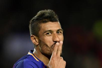 Barcelona's Brazilian midfielder Paulinho celebrates after scoring during the Spanish league football match FC Barcelona against RC Deportivo de la Coruna at the Camp Nou stadium in Barcelona on December 17, 2017. / AFP PHOTO / JAVIER SORIANO