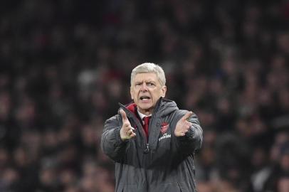 Arsenals French manager Arsene Wenger gestures from the touchline during the English League Cup quarter-final football match between Arsenal and West Ham United at the Emirates Stadium in London on December 19, 2017.  / AFP PHOTO / Ben STANSALL / RESTRICTED TO EDITORIAL USE. No use with unauthorized audio, video, data, fixture lists, club/league logos or live services. Online in-match use limited to 75 images, no video emulation. No use in betting, games or single club/league/player publications.  / 