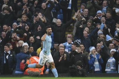 Manchester Citys Argentinian striker Sergio Aguero celebrates scoring the opening goal during the English Premier League football match between Manchester City and Bournemouth at the Etihad Stadium in Manchester, north west England, on December 23, 2017. / AFP PHOTO / Oli SCARFF / RESTRICTED TO EDITORIAL USE. No use with unauthorized audio, video, data, fixture lists, club/league logos or live services. Online in-match use limited to 75 images, no video emulation. No use in betting, games or single club/league/player publications.  / 