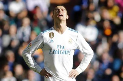 Real Madrids Portuguese forward Cristiano Ronaldo reacts during the Spanish League Clasico football match Real Madrid CF vs FC Barcelona at the Santiago Bernabeu stadium in Madrid on December 23, 2017.  / AFP PHOTO / OSCAR DEL POZO