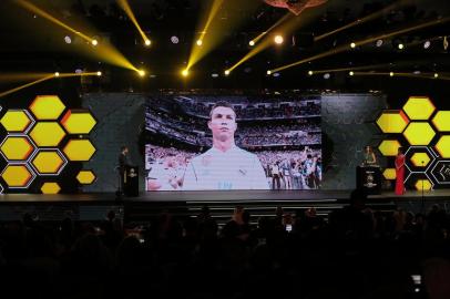 Real Madrids Portuguese forward Cristiano Ronaldo is seen on a screen after the announcement of his reception of the Best player award during the Globe Soccer Awards Ceremony at the end of the 12th Edition of the Dubai International Sports Conference on December 28, 2017 in Madinat Jumeirah Resort in Dubai. / AFP PHOTO / MAHMOUD KHALED