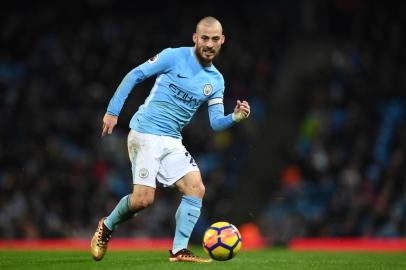 Manchester Citys Spanish midfielder David Silva passes the ball during the English Premier League football match between Manchester City and Watford at the Etihad Stadium in Manchester, north west England, on January 2, 2018. / AFP PHOTO / Paul ELLIS / RESTRICTED TO EDITORIAL USE. No use with unauthorized audio, video, data, fixture lists, club/league logos or live services. Online in-match use limited to 75 images, no video emulation. No use in betting, games or single club/league/player publications.  / 