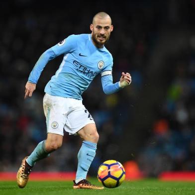 Manchester Citys Spanish midfielder David Silva passes the ball during the English Premier League football match between Manchester City and Watford at the Etihad Stadium in Manchester, north west England, on January 2, 2018. / AFP PHOTO / Paul ELLIS / RESTRICTED TO EDITORIAL USE. No use with unauthorized audio, video, data, fixture lists, club/league logos or live services. Online in-match use limited to 75 images, no video emulation. No use in betting, games or single club/league/player publications.  / 