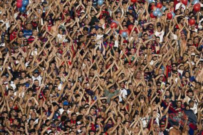 TOPSHOTSSupporters of San Lorenzo cheer for their team during the Argentina First Division football match against Huracan, at Pedro Bidegain stadium in Buenos Aires, Argentina, on March 15, 2015. AFP PHOTO / ALEJANDRO PAGNI