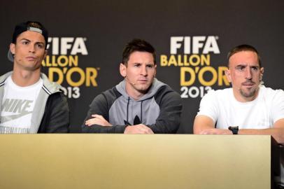 2013 FIFA Ballon dOr nominees (L-R) Real Madrids Portuguese forward Cristiano Ronaldo, Barcelonas Argentine forward Lionel Messi and Bayern Munichs French midfielder Franck Ribery attend a press conference ahead of the FIFA Ballon dOr award ceremony at the Kongresshaus in Zurich on January 13, 2014.  AFP PHOTO / OLIVIER MORIN