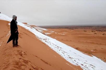 A man looks at at a snow-covered slope in the Sahara, Ain SefraA man looks at at a snow-covered slope in the Sahara, Ain Sefra, Algeria, January 7, 2018 in this picture obtained from social media. Hamouda Ben Jerad/via REUTERS THIS IMAGE HAS BEEN SUPPLIED BY A THIRD PARTY. MANDATORY CREDIT.NO RESALES. NO ARCHIVES ORG XMIT: SIN700Local: Ain Sefra ;Algeria