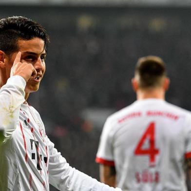 Bayern Munichs midfielder James Rodriguez celebrates after scoring during the German First division Bundesliga football match Bayer Leverkusen vs FC Bayern Munich on January 12, 2018 in Leverkusen, western Germany. / AFP PHOTO / SASCHA SCHUERMANN / RESTRICTIONS: DURING MATCH TIME: DFL RULES TO LIMIT THE ONLINE USAGE TO 15 PICTURES PER MATCH AND FORBID IMAGE SEQUENCES TO SIMULATE VIDEO. == RESTRICTED TO EDITORIAL USE == FOR FURTHER QUERIES PLEASE CONTACT DFL DIRECTLY AT + 49 69 650050