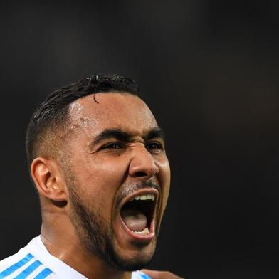 Olympique de Marseilles French forward Dimitri Payet reacts after scoring during the French L1 football match Marseille vs Strasbourg on January 16, 2018 at the Velodrome stadium in Marseille, southern France.  / AFP PHOTO / ANNE-CHRISTINE POUJOULAT