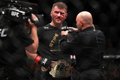 BOSTON, MA - JANUARY 20: Stipe Miocic speaks to Joe Rogan after defeating Francis Ngannou in their Heavyweight Championship fight during UFC 220 at TD Garden on January 20, 2018 in Boston, Massachusetts.   Mike Lawrie/Getty Images/AFP