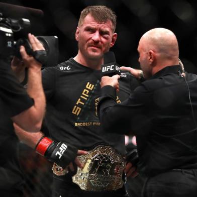 BOSTON, MA - JANUARY 20: Stipe Miocic speaks to Joe Rogan after defeating Francis Ngannou in their Heavyweight Championship fight during UFC 220 at TD Garden on January 20, 2018 in Boston, Massachusetts.   Mike Lawrie/Getty Images/AFP