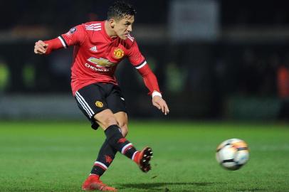 Manchester Uniteds Chilean striker Alexis Sanchez takes a shot at goal during the FA Cup fourth round football match between Yeovil Town and Manchester United at Huish Park in Yeovil, Somerset on January 26, 2018. / AFP PHOTO / - / RESTRICTED TO EDITORIAL USE. No use with unauthorized audio, video, data, fixture lists, club/league logos or live services. Online in-match use limited to 75 images, no video emulation. No use in betting, games or single club/league/player publications.  / 