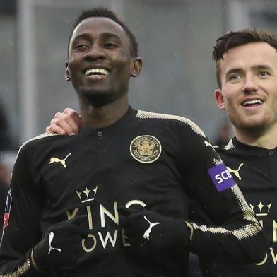 Leicester Citys Nigerian midfielder Wilfred Ndidi (L) celebrates scoring their fifth goal during the English FA Cup fourth round football match between Peterborough United and Leicester City at London Road stadium in Peterborough, eastern England, on January 27, 2018. / AFP PHOTO / Lindsey PARNABY / RESTRICTED TO EDITORIAL USE. No use with unauthorized audio, video, data, fixture lists, club/league logos or live services. Online in-match use limited to 75 images, no video emulation. No use in betting, games or single club/league/player publications.  / 