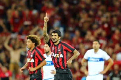 Lucho Gonzalez of Brazils Atletico Paranaense celebrates a goal against Universidad de Chile during a Libertadores Cup football match at the Arena da Baixada stadium in Curitiba, Brazil on March 7, 2017.  / AFP PHOTO / Heuler Andrey