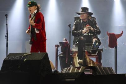 PORTUGAL-CONCERT-ACDC-MUSICUS singer Axl Rose (L) and Angus Young (R) of Australian Rock band AC/DC perform in Lisbon on May 7, 2016. Aussie rockers AC/DC wrote a new chapter in their 42-year career on today, launching a European tour with Guns N Roses Axl Rose replacing Brian Johnson as frontman.PATRICIA DE MELO MOREIRA / AFP