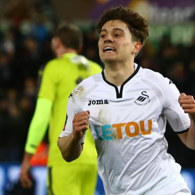 Swansea Citys Welsh midfielder Daniel James celebrates after scoring their eighth goal during the English FA Cup fourth round replay football match between Swansea City and Notts County at The Liberty Stadium in Swansea, south Wales on February 6, 2018. / AFP PHOTO / Geoff CADDICK / RESTRICTED TO EDITORIAL USE. No use with unauthorized audio, video, data, fixture lists, club/league logos or live services. Online in-match use limited to 75 images, no video emulation. No use in betting, games or single club/league/player publications.  / 